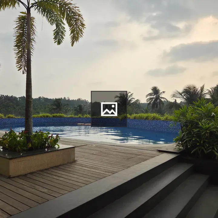 Swimming pool with lush greenery