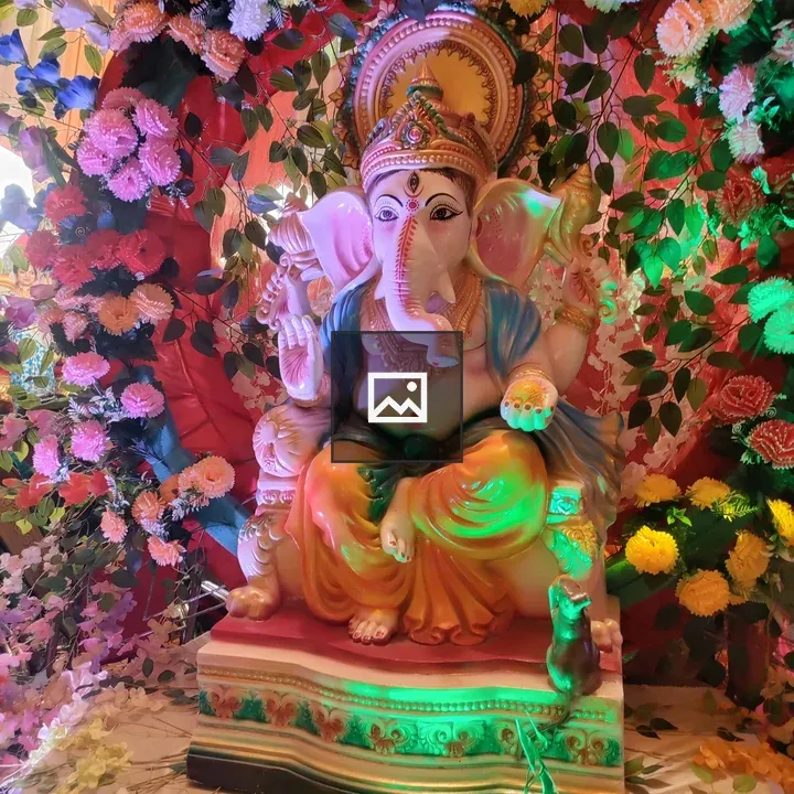 Statue of Ganesha with Floral Arrangement
