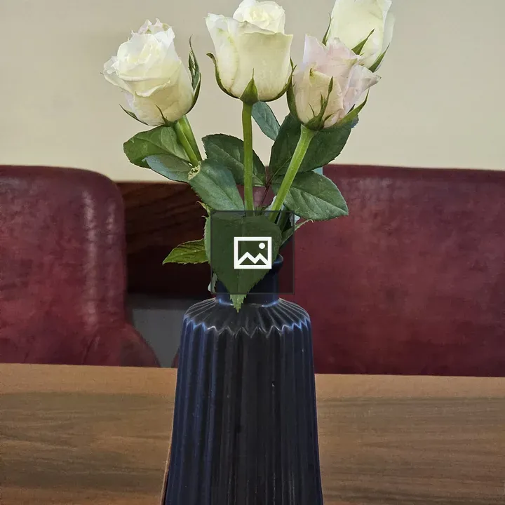 Blue Ridged Vase with White Roses