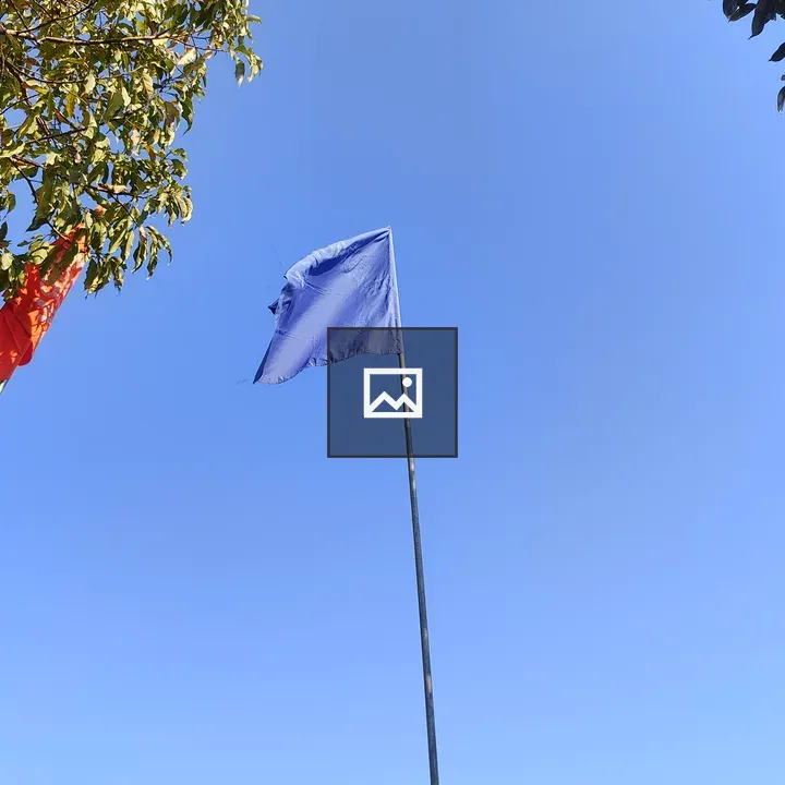 Three Flags Against Blue Sky