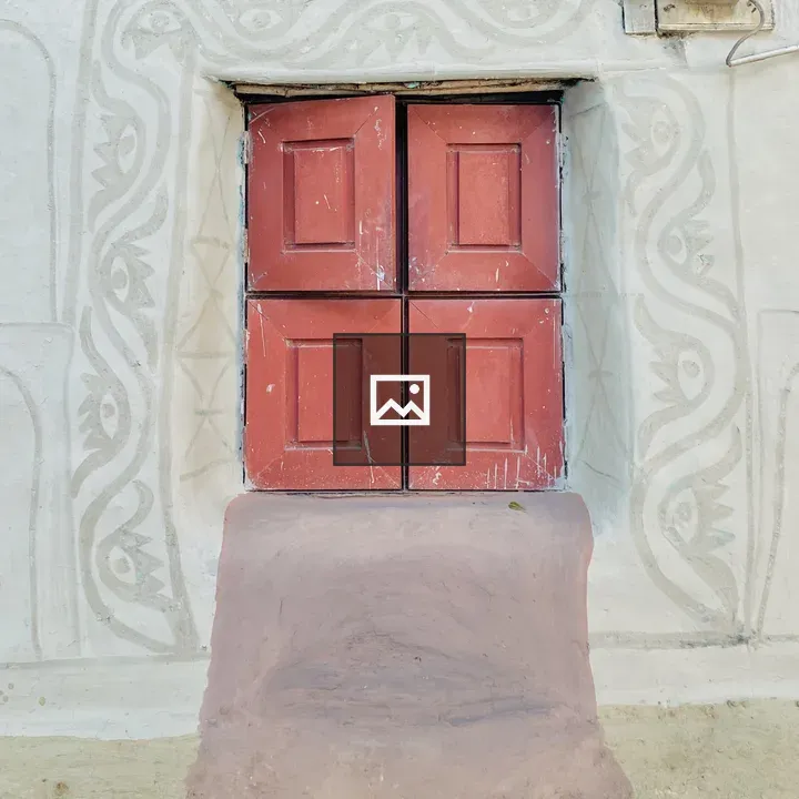Weathered wall with four red panels