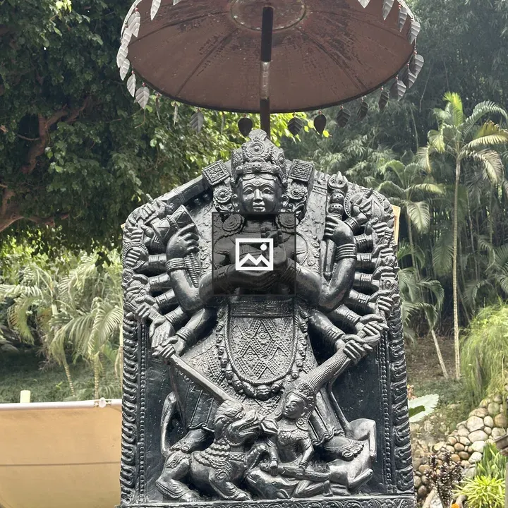 Ornate black statue with parasol