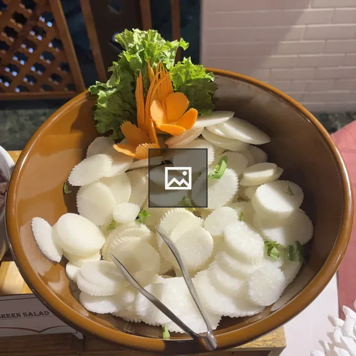 Brown bowl with radish slices