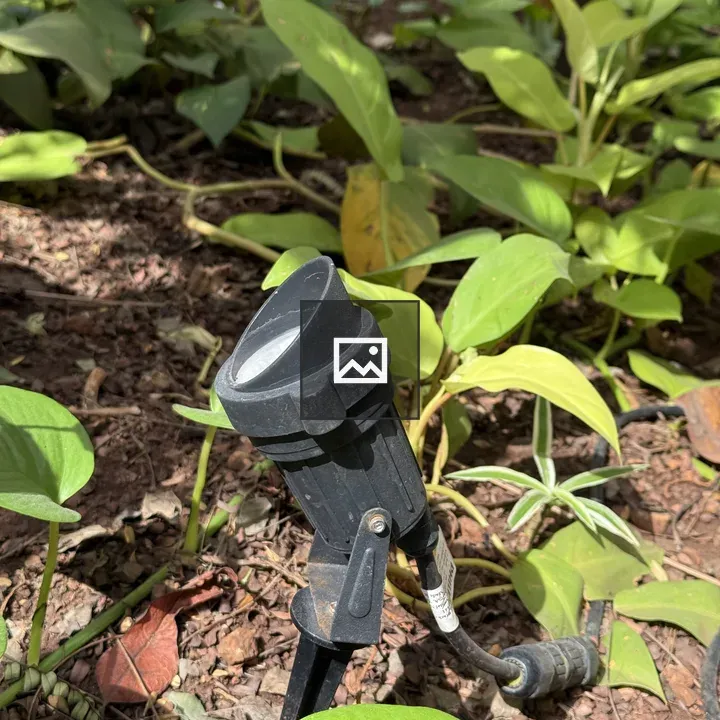 Garden lamp in parking lot grass