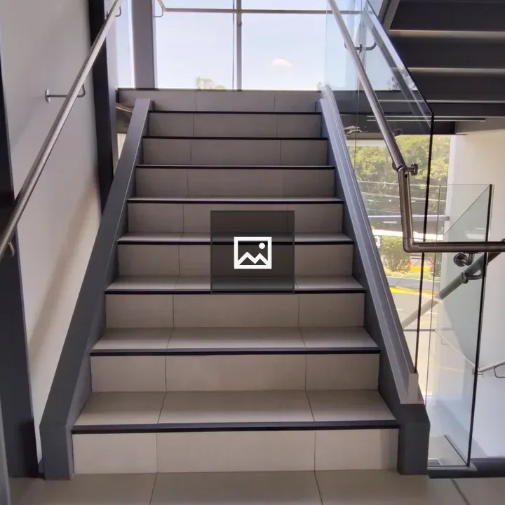 Modern staircase with metal handrail