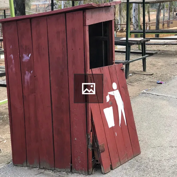 Red wooden trash bin with icon