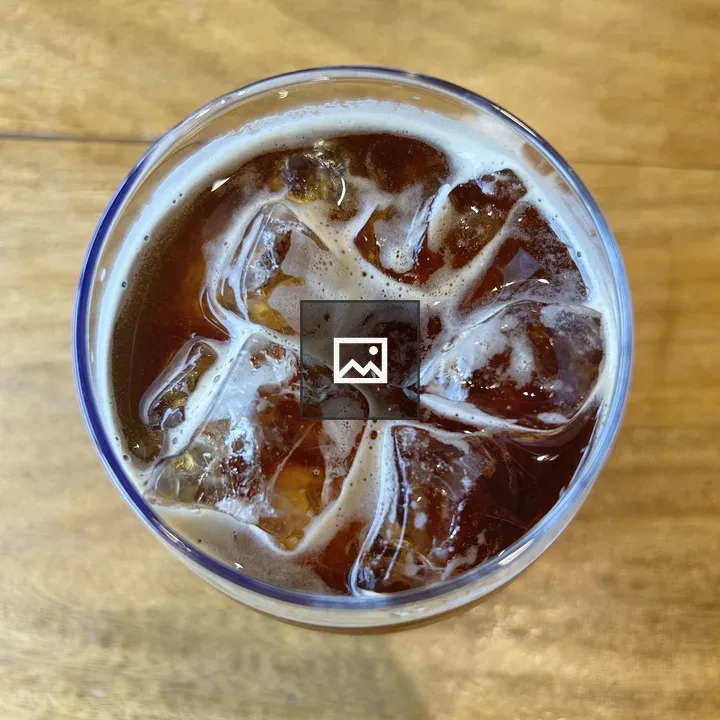 Glass of iced coffee on table