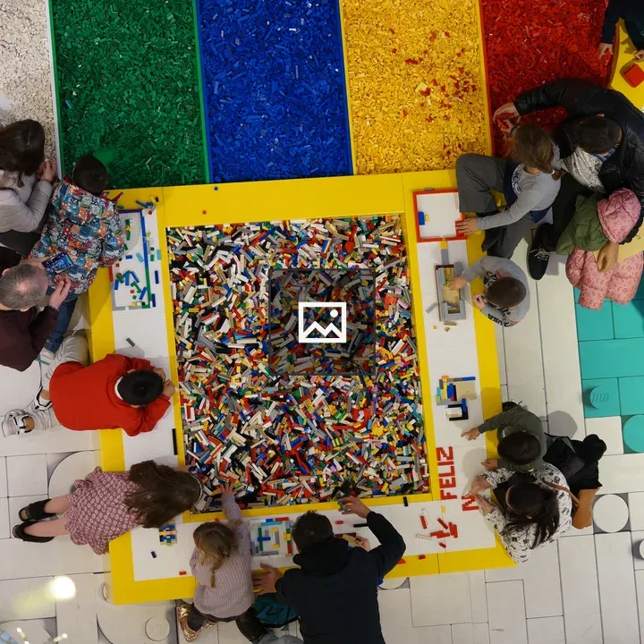 Kids and adults with construction bricks