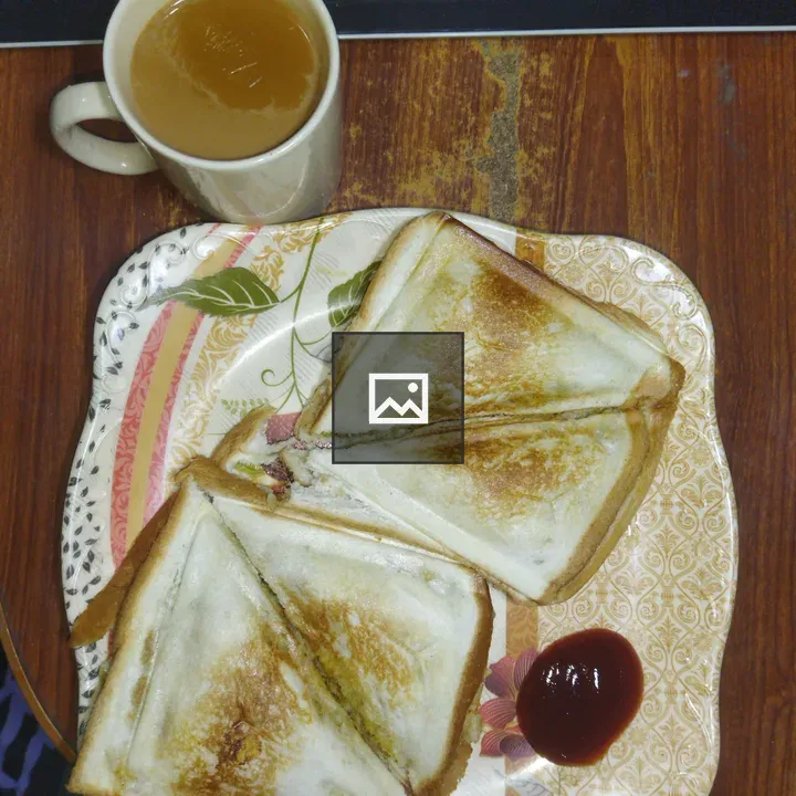 Toasted sandwiches on floral plate