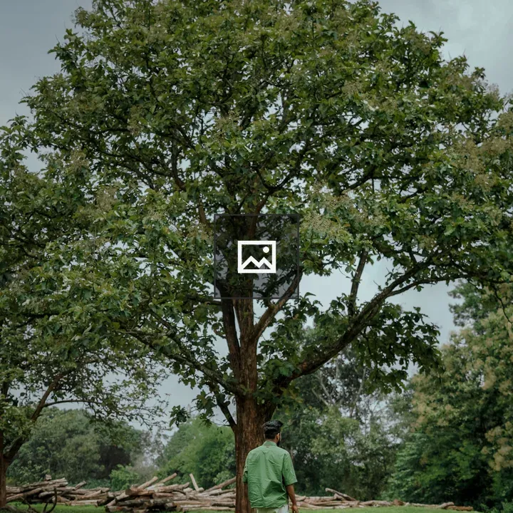 Man Walking in Grass Field