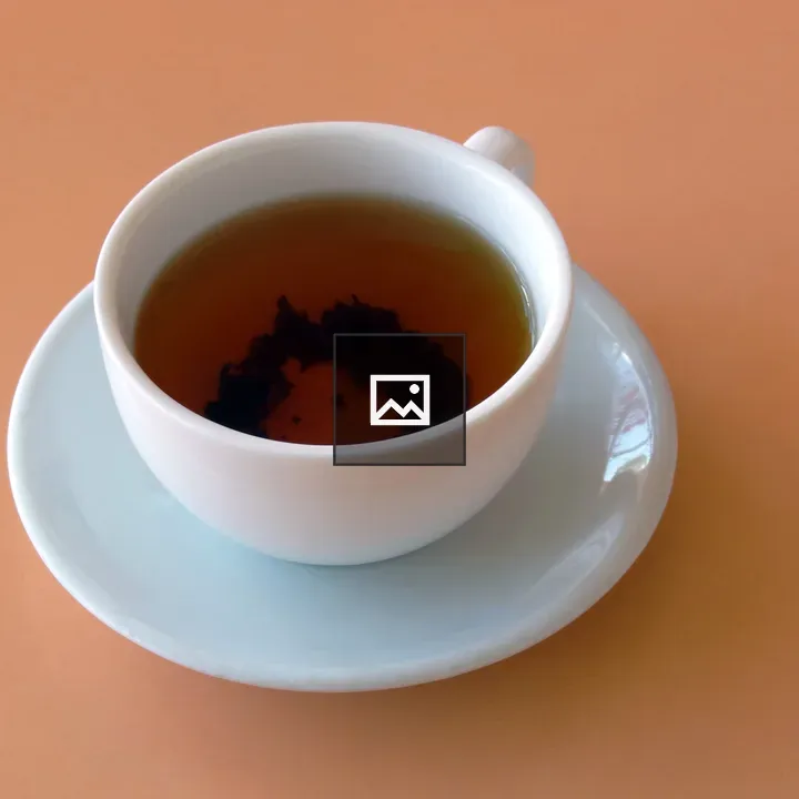Cup of tea on peach table