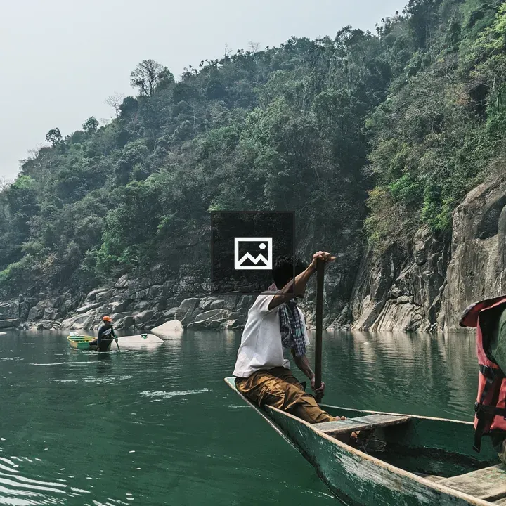 Man rowing boat at sea