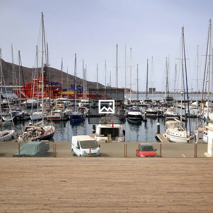 Marina with Sails and Red Ship