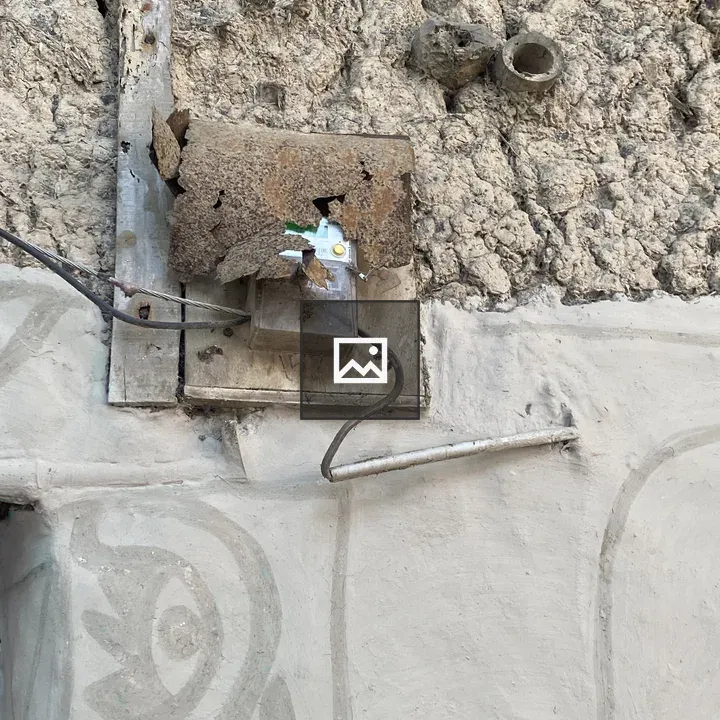 Weathered Wall with Rusted Box