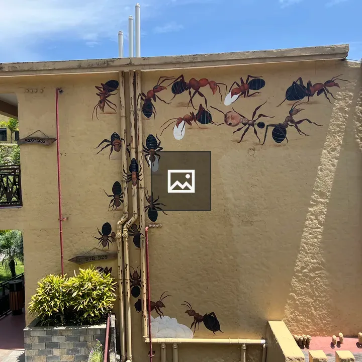 Ants mural on beige wall