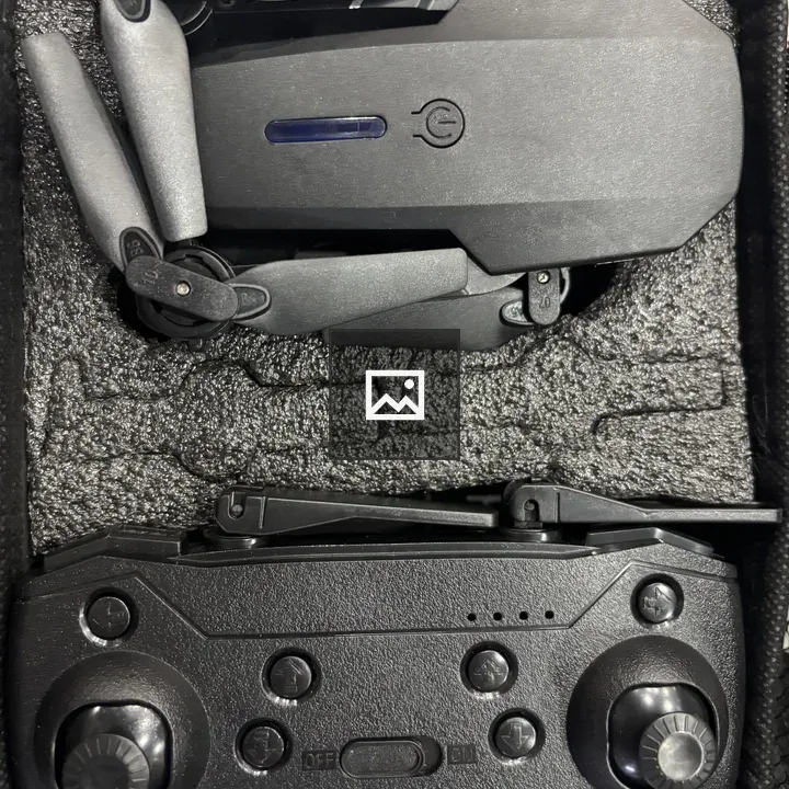 Compact black drone in case