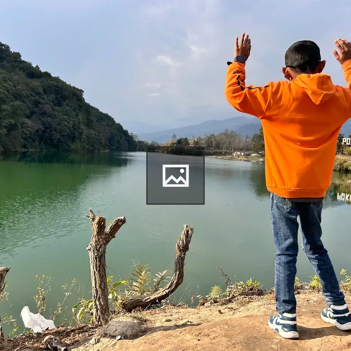 Child by the lakeside