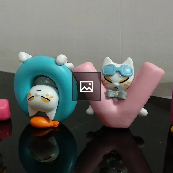 Figures with cats spelling LOVE