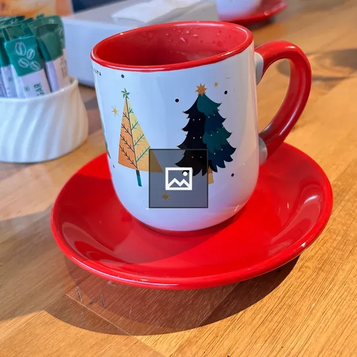 Festive cup on red saucer