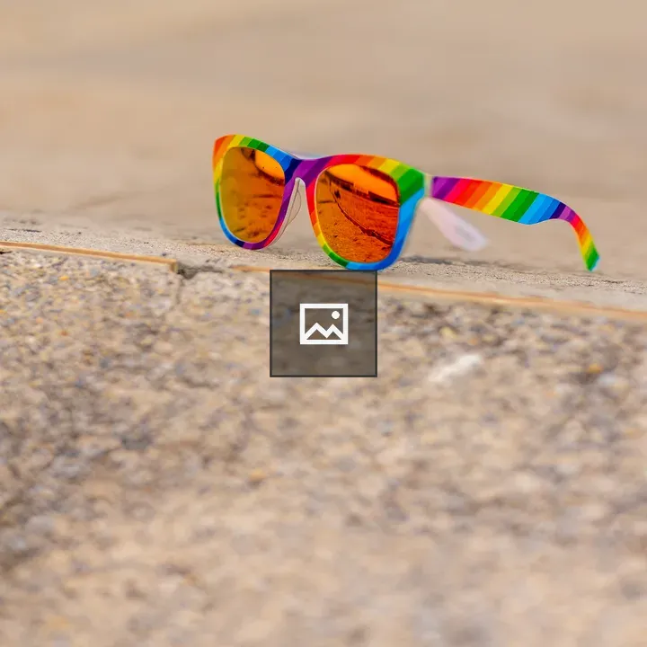 Rainbow mirrored sunglasses on ground