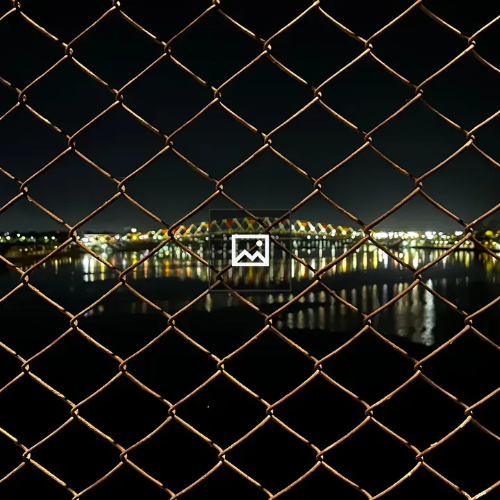 Chain-link Fence by Night Bridge