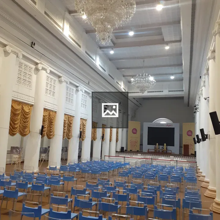 Indoor venue with blue chairs