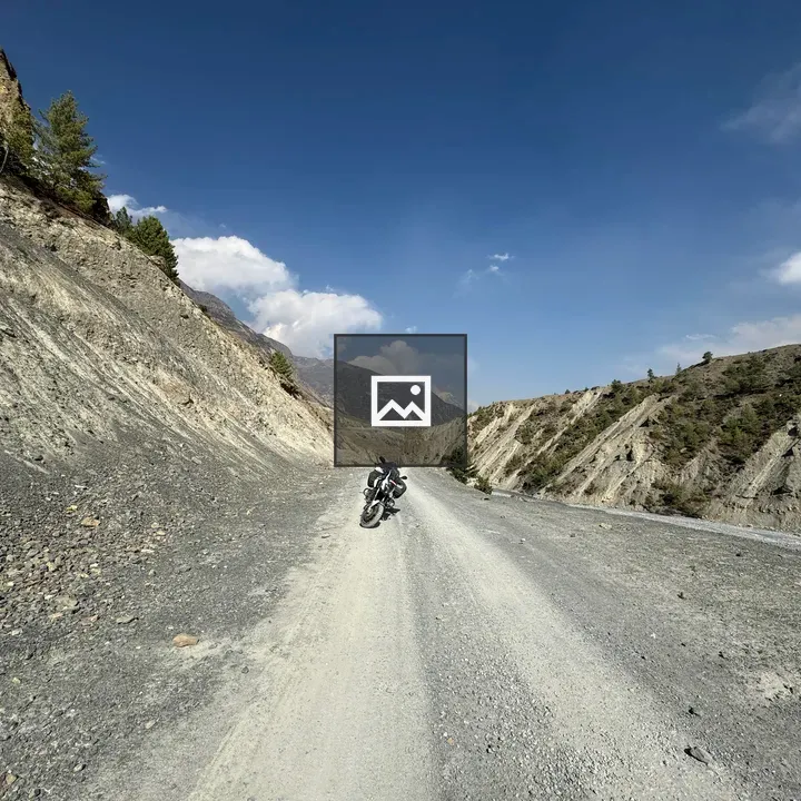 Black and white adventure motorcycle with luggage