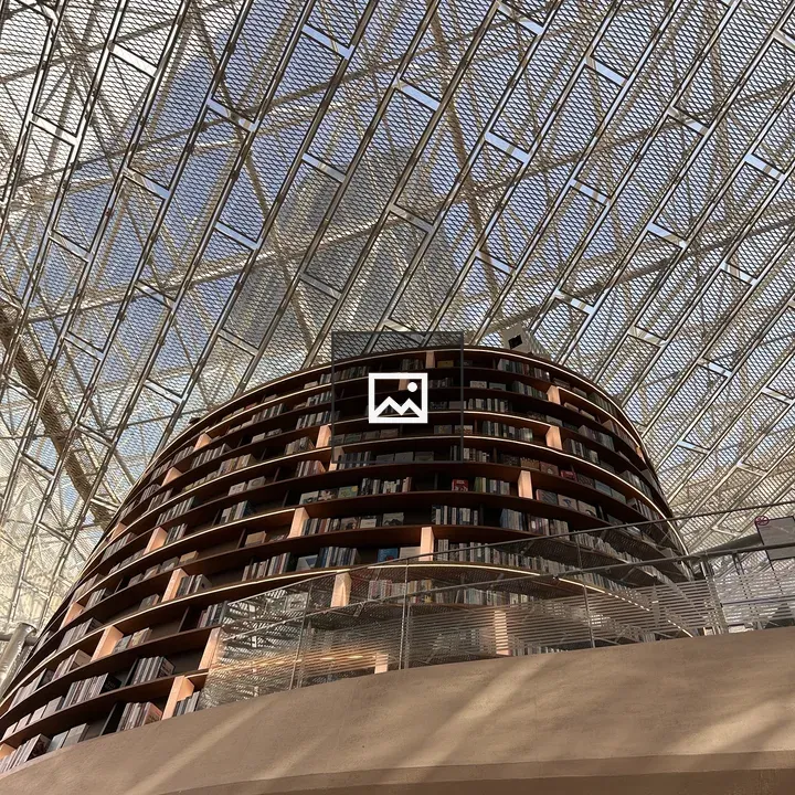 Modern library interior with curved bookshelf