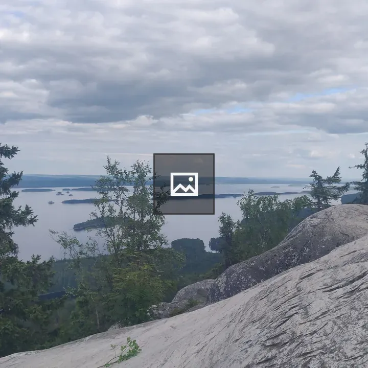 View from cliff over forest and lakes