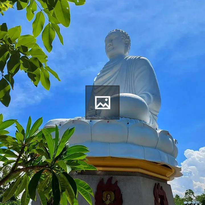 White Buddha Statue against Sky