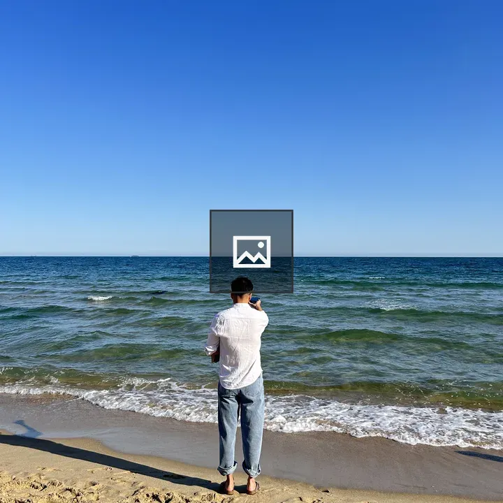 Man on the Beach Facing Sea