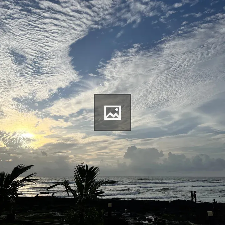 Beach at Sunset with Palm Silhouettes