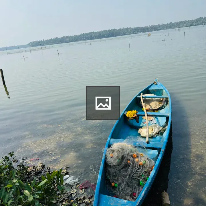 Blue boat on calm Kerala river