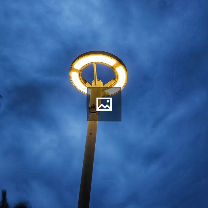 Tall street lamp at dusk