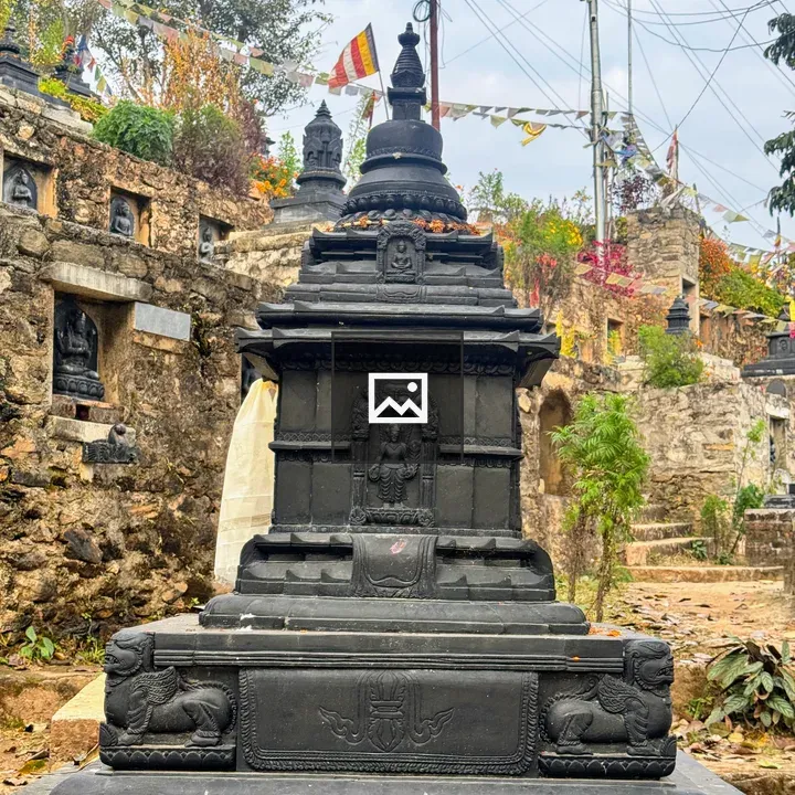 Black ornate stone stupa