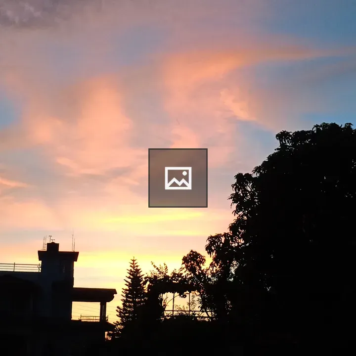 House silhouette at sunset