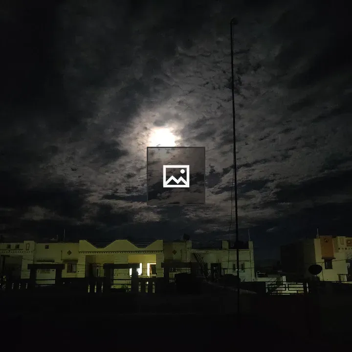 Night sky over houses at dusk
