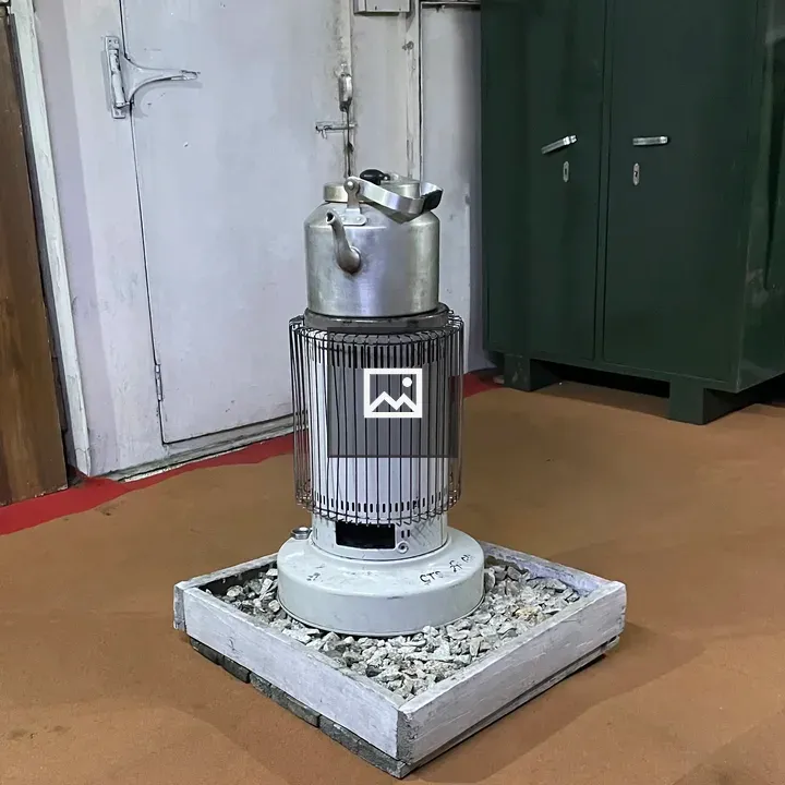 Silver Kettle on Kerosene Heater