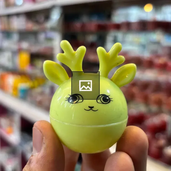 Person with yellow ball toy