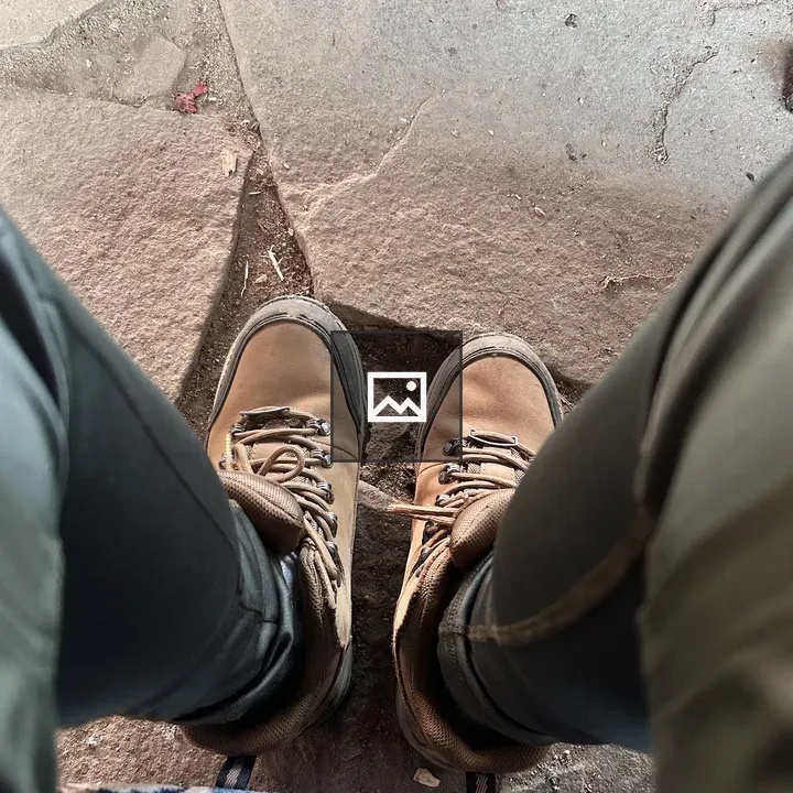 Hiking boots on path viewed from above