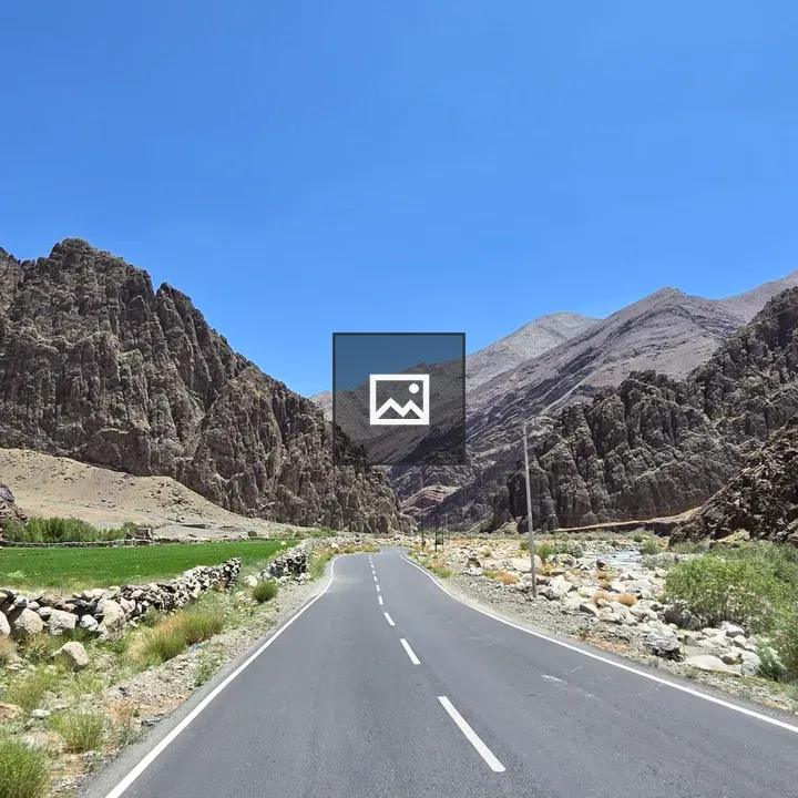 Paved Road Through Mountain Landscape