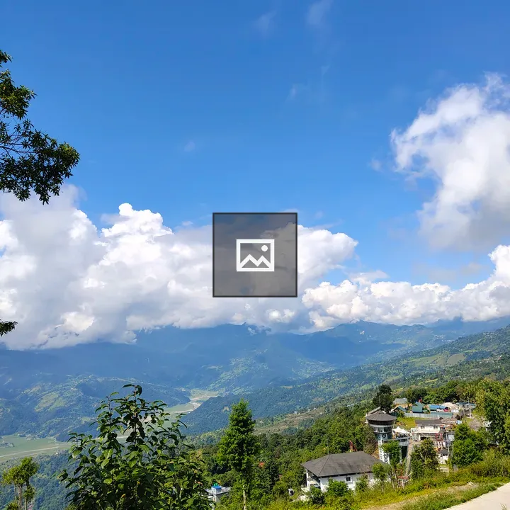Hillside village under blue sky