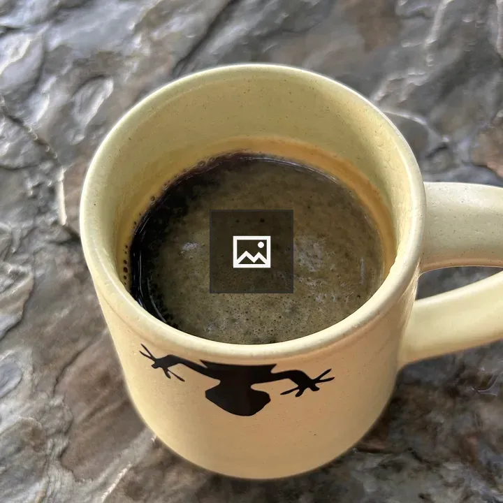 Beige mug with frog silhouette