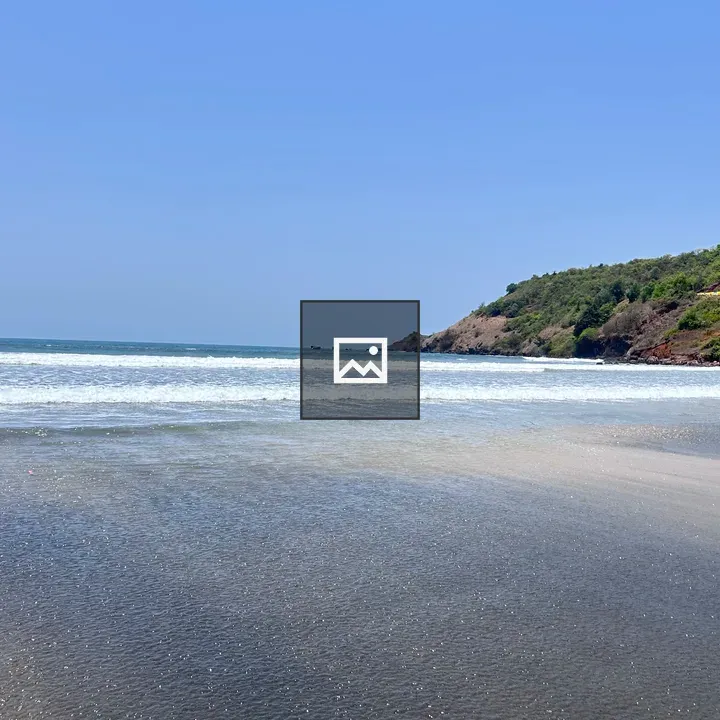 Beach scene with blue sky and waves