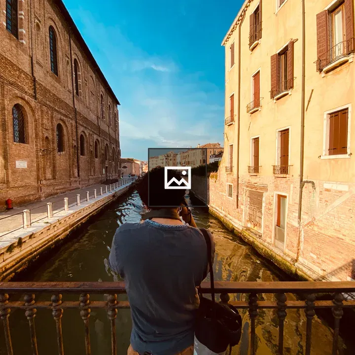 Venetian canal with bridge view