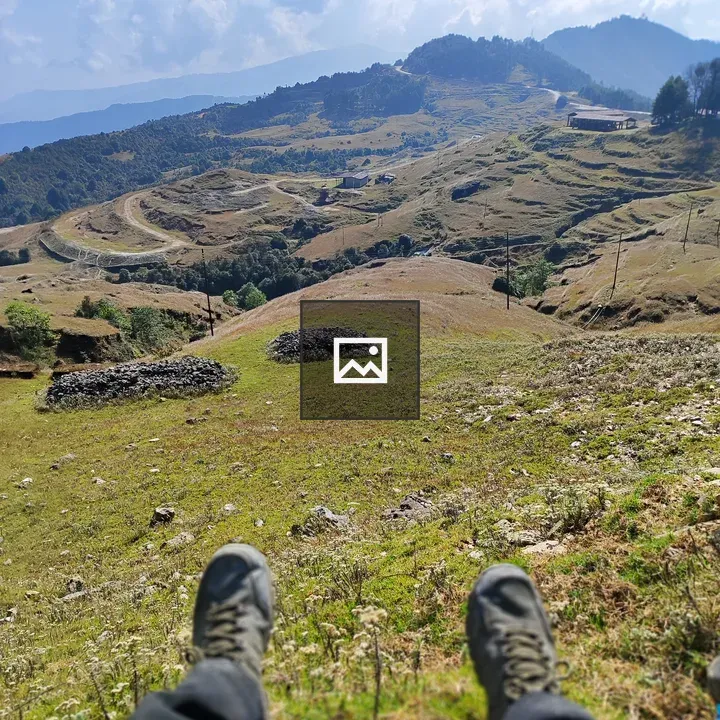 Feet in Hiking Shoes Over Looking Hills