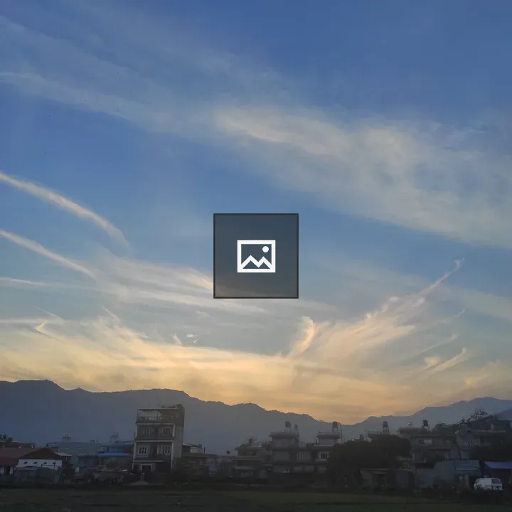 Crepuscular Sky Over Hills and City