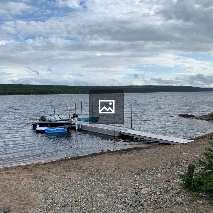 Boat on Gambo Pond shore