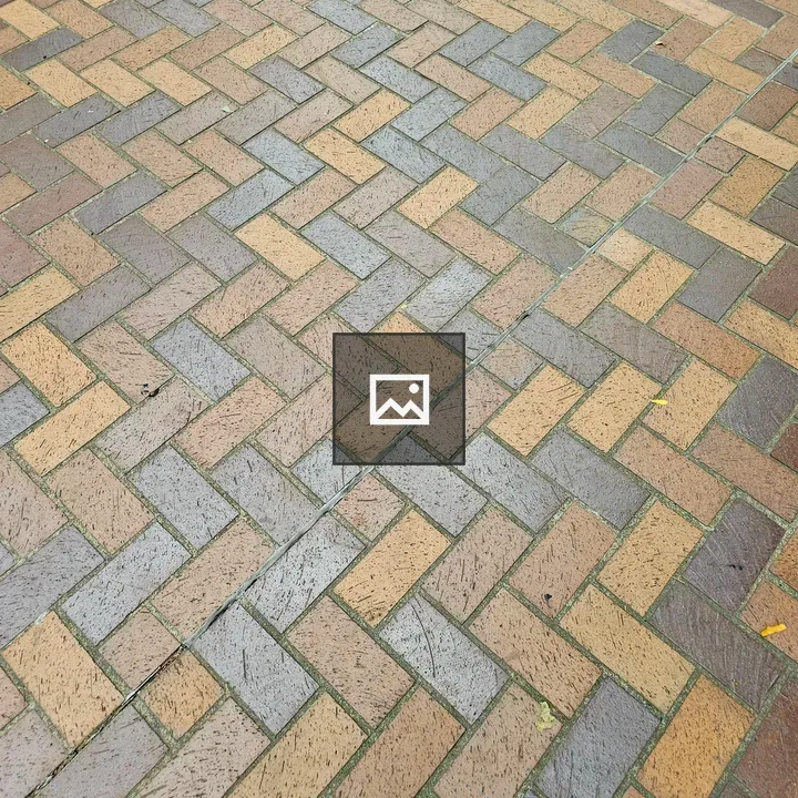 Paved surface with herringbone bricks
