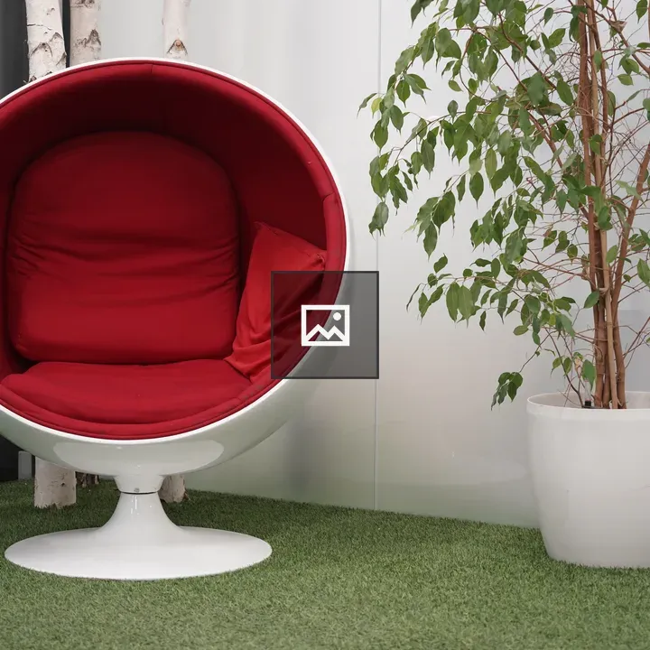 Circular chair with red cushion